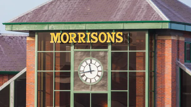 Morrisons supermarket exterior with clock.